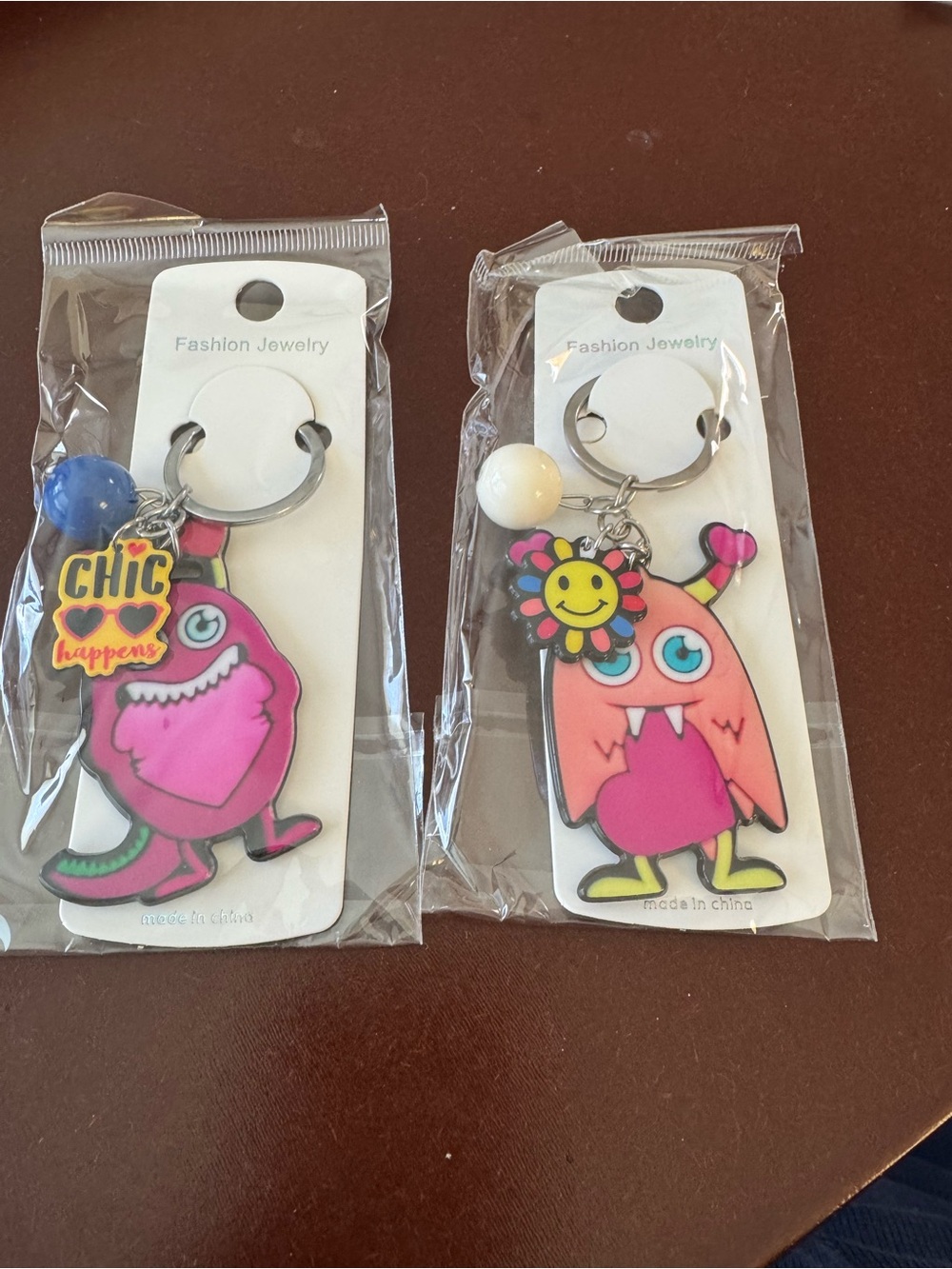 Cute Pink Monster Keychain Set with Colorful Charms